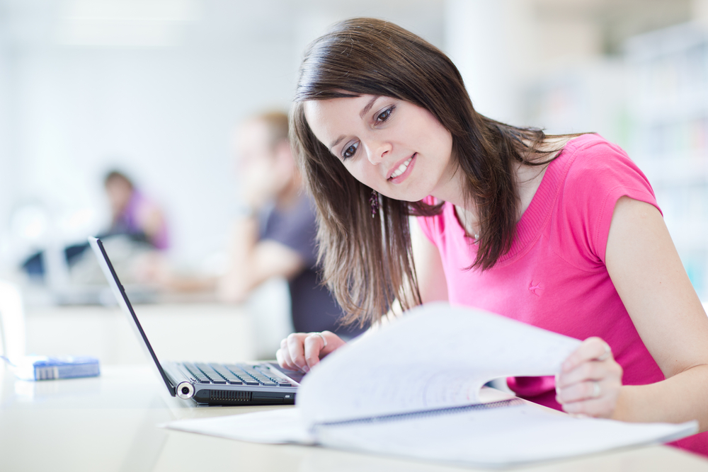 Happy, focused student studying