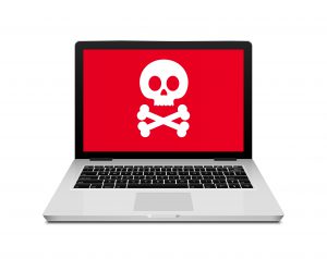Open laptop with skull and crossbones onscreen.